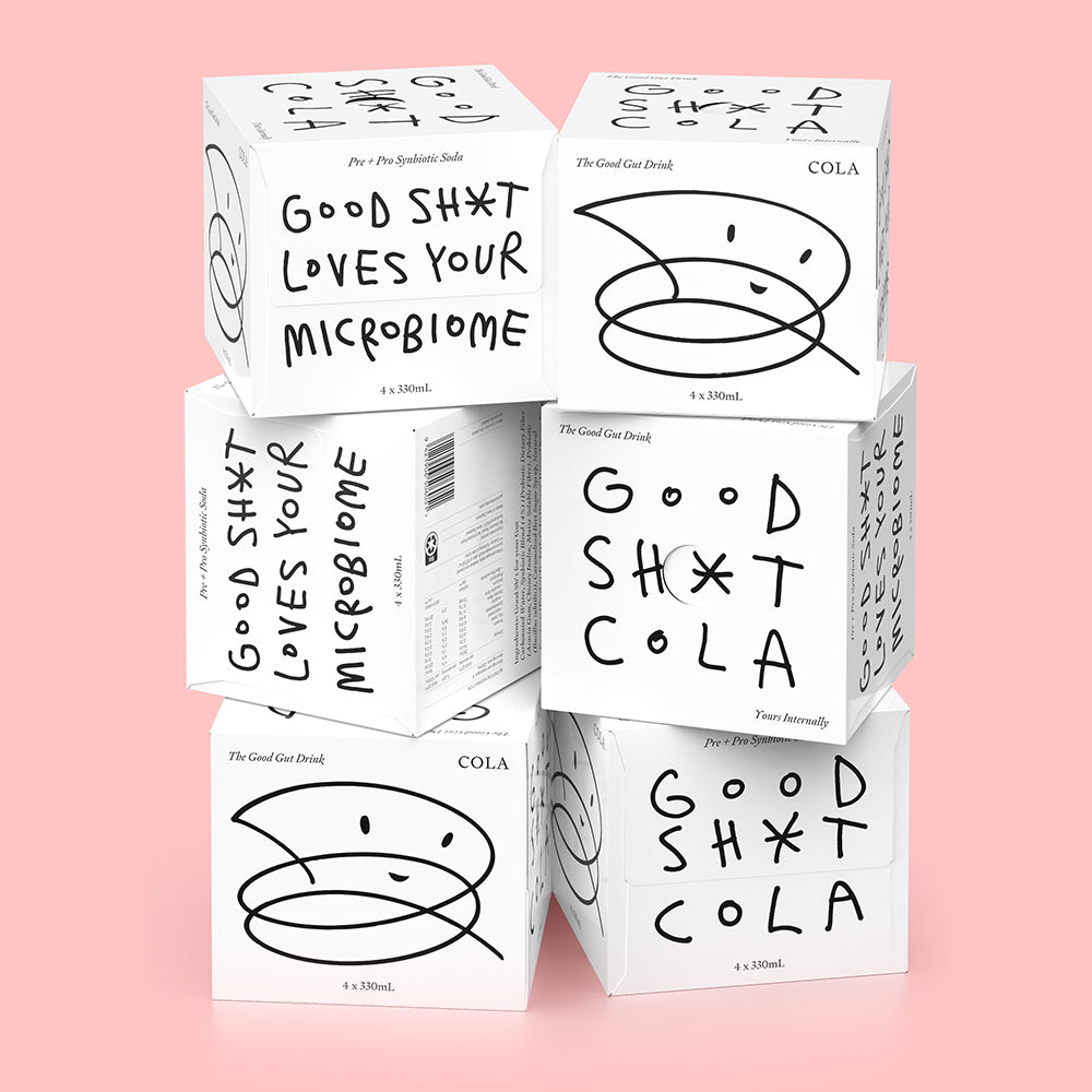 A stack of six 4 pack boxes of Good Shit cola pre + probiotic soda