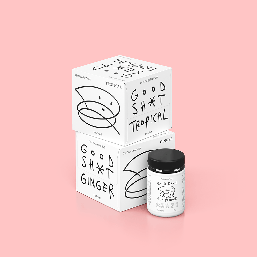 A stack of two 4 pack boxes of Good Shit pre + probiotic soda. One box each of ginger and tropical, plus a tub of Good Shit pre + probiotic Gut Powder, containing enough powder for 7 days