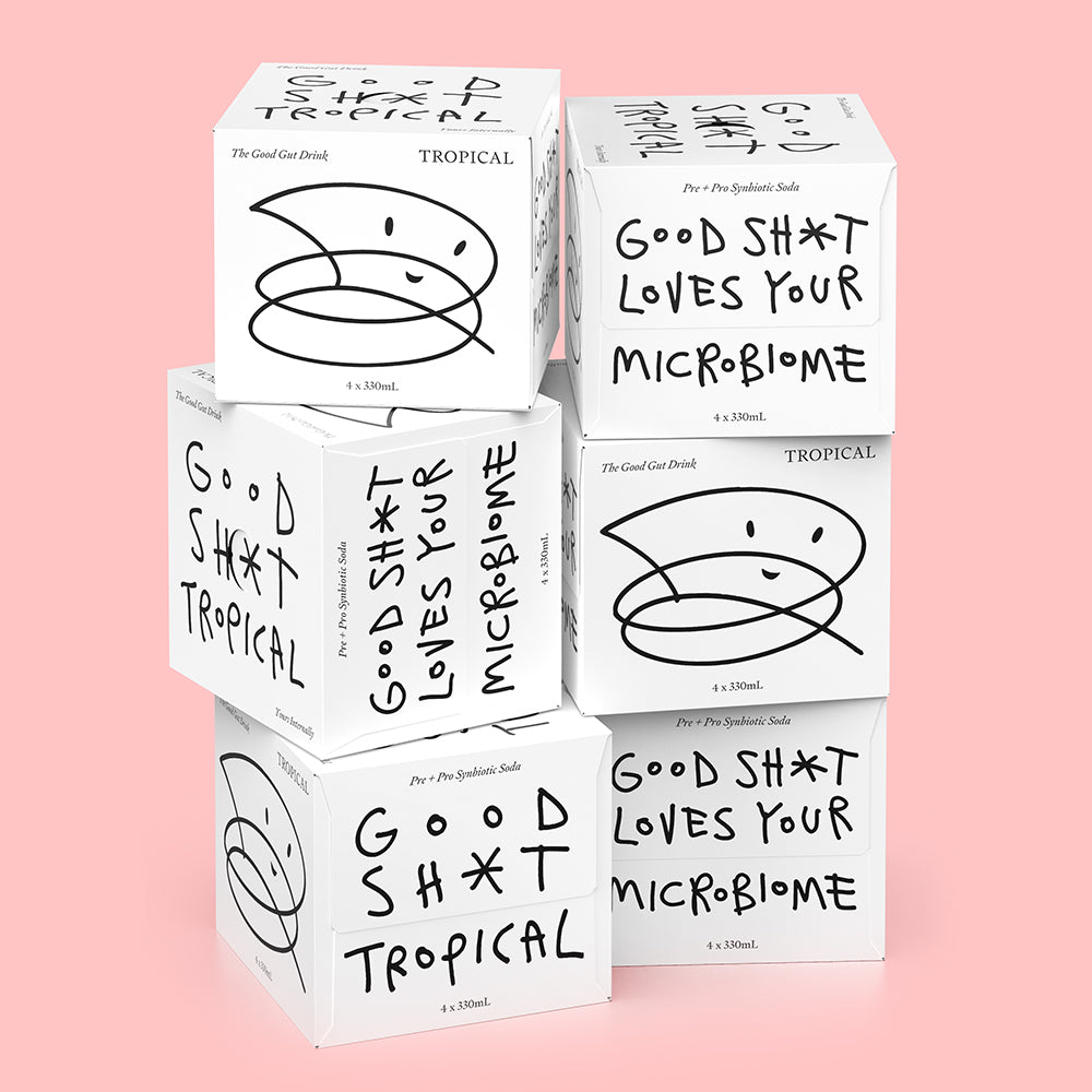 A stack of six 4 pack boxes of Good Shit tropical pre + probiotic soda
